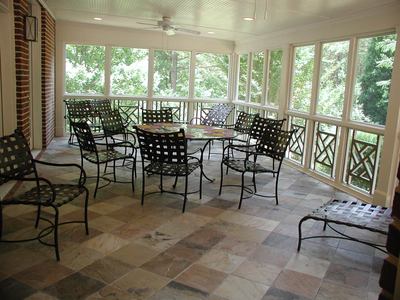 Indoor Sunroom Furniture on Porch With Travertine Floor Would Convert Beautifully Into A Sunroom