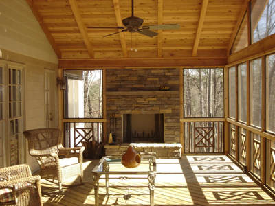 Outdoor fireplace on screened porch